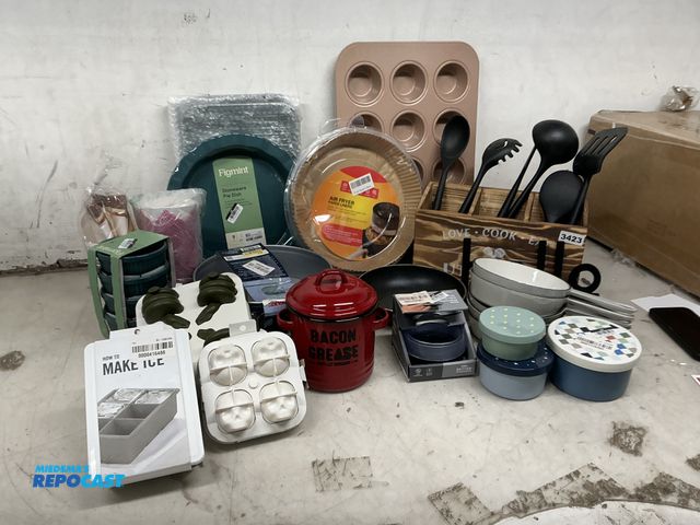 Lot 2-75895 - Lot of new kitchen decor/items cupcake pan, ice cube tray, cast iron 6”, cake pan, utensils, and cut...