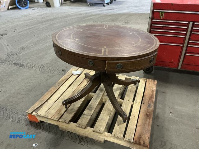 Lot 2-19633 - Baker Furniture Antique leather drum side table with two drawers- one of the legs needs to be tighte...