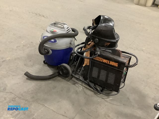 Lot 2-15578 - Rollable 6 gallon 3hp shop vacuum and Chicago electric welder with welding mask