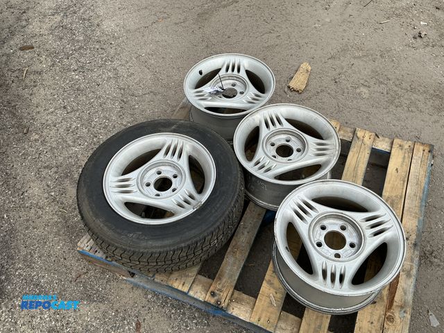 Lot 2-18984 - Lot of (4) mustang 94’ tire rims, one with Coopea LifeLiner Classic II Tires P205/65R15
