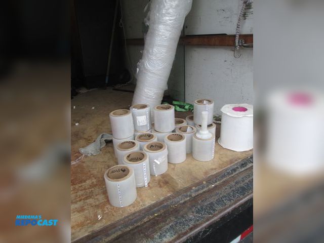Lot 2-59153 - 17 rolls of 5 1/2" tall plastic wrap film. dispenser. 1 8" x 7" plastic adhesive roll. 1 roll of pla...
