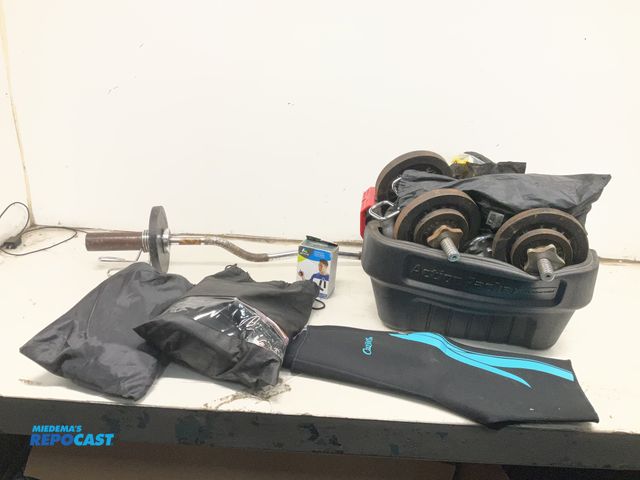 Lot 2-74299 - Lot of various workout equipment including resistance hand grips, weights, waist trainer, and more