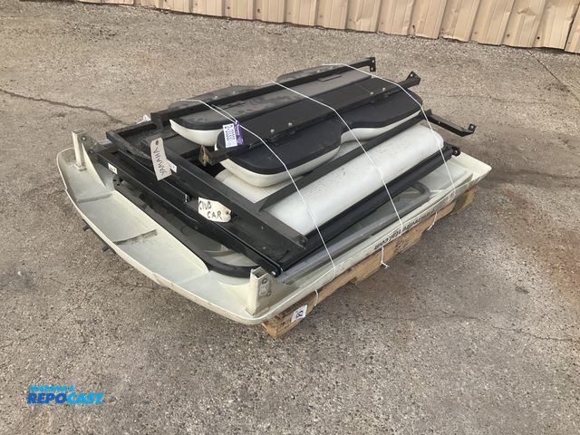 Lot 2-33330 - Skid of misc golf cart parts including seat backs, fold down seats and a roof, used