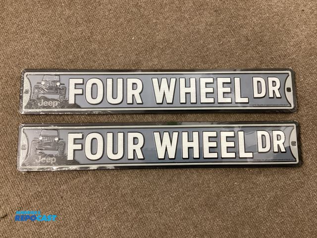 Lot 2-77713 - Two new Jeep FOUR WHEEL DR. Metal signs. Measures approximately 20” X 3-1/2”. Has holes on the ends ...