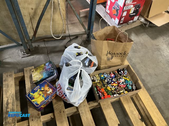 Lot 2-33775 - Lot of various toy cars, (2) metal Pokémon lunch boxes, and toy car ramps