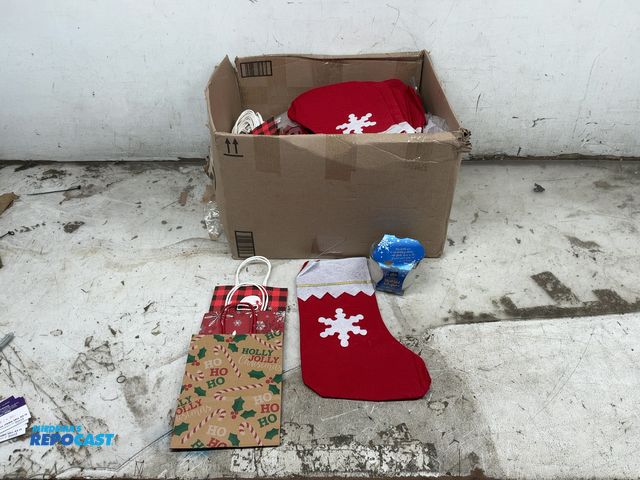 Lot 2-33582 - Lot of Christmas stockings, gift bags, &amp; candles.