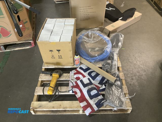 Lot 2-96731 - Skid lot of various items including “saturdays are for the boys” flags, floor mats, kayak paddles, a...