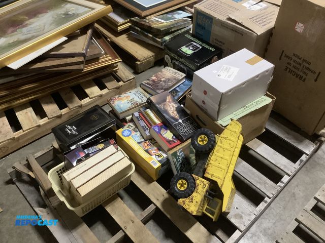 Lot 2-15595 - Skid of various items including a vintage toy truck, (2) Yolanda picture perfect baby’s, books, and ...