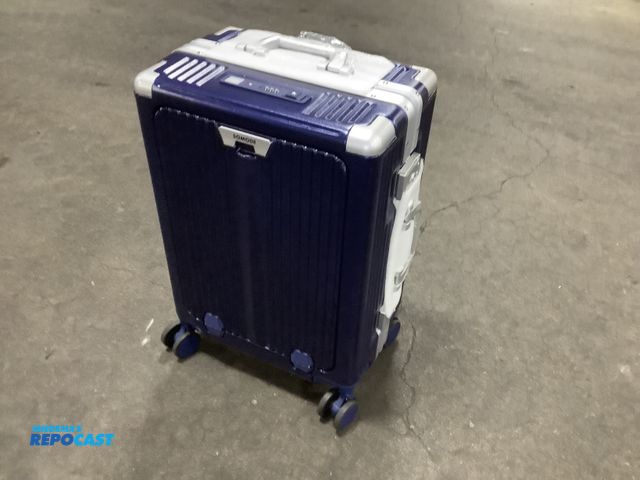 Lot 2-32684 - Lot of (2) somode blue suitcases with lock to open and a cup holder on side heavy duty metal edges a...