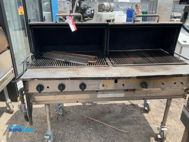 Lot 2-75927 - Magicater natural gas grill with measurements of approximately 62” x 53”