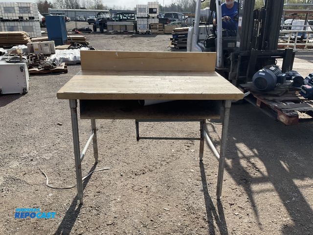 Lot 2-77052 - Commercial Kitchen Chopping Table with Backsplash Board and Lower Shelving, Has Stainless Steel Legs...