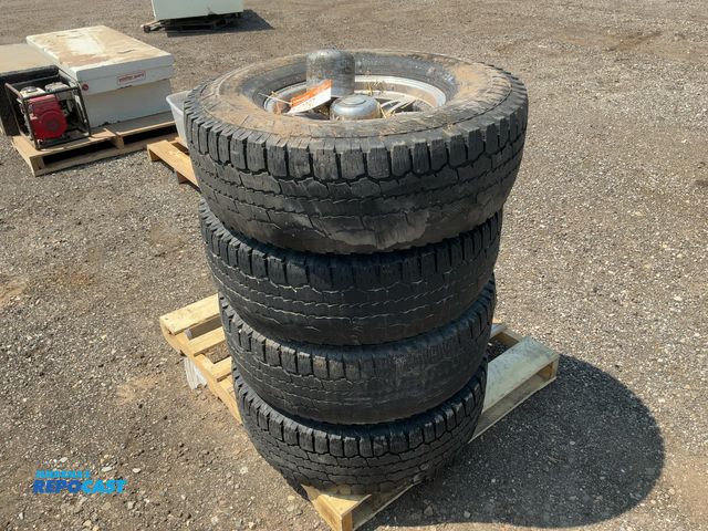 Lot 2-40297 - (4) Aluminum 16" 8 lug Trailer Wheels with 285/75R16 tires, 8 on 6.5" bolt pattern, missing one cent...