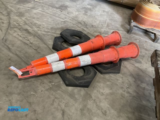 Lot 2-44703 - (4) Plasticade traffic cones with rubber bases, each is 49” tall overall