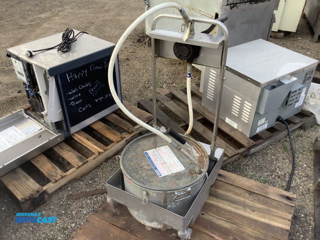 Lot 2-93566 - Lot of (1) miroil pump and filter pot. (75HD)