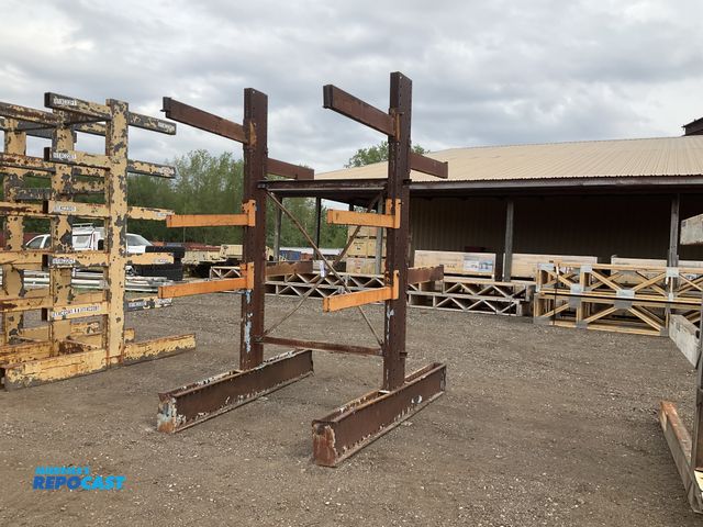 Lot 2-34494 - Two sided metal cantilever rack 66”W x 96-1/2” x 119”T overall, bolt on rack arms 42”L, used, some b...