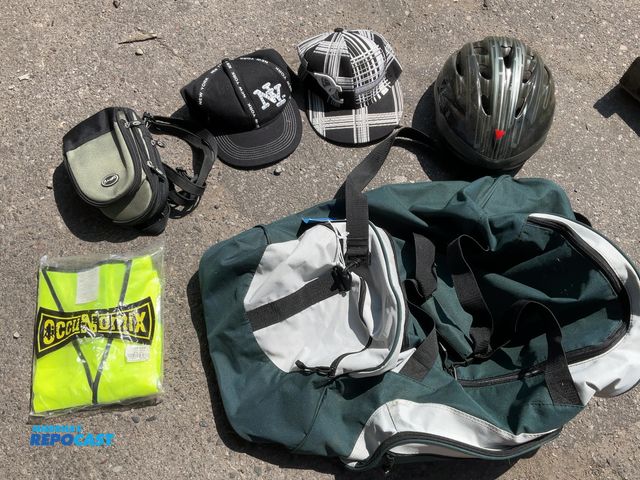 Lot 2-95114 - Port and company duffel bag a helmet a bike bag 2 hats and a visor