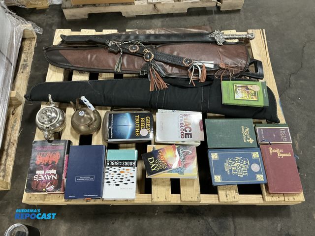 Lot 2-95991 - Skid lot with various devotional, books, Bibles, sword, air gun, machetes…
