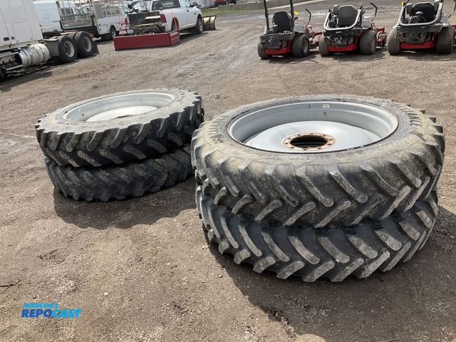 Lot 2-22305 - (4) 380/90R46 ag tires on steel 10 bolt wheels, used, one newer, two approx. 40% tread, and one bald