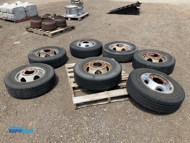 Lot 2-11160 - (7) 235/80R17 tires on steel 8-bolt wheels, comes with lugnuts and (2) front and (2) rear center cap...