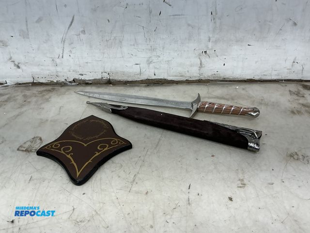 Lot 2-92075 - 15” Sting sword with sleeve and wooden mounting piece