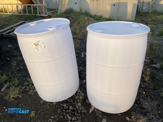 Lot 2-33132 - 2 55 gallon white plastic barrels with removable bungs, clean inside, contained vinegar