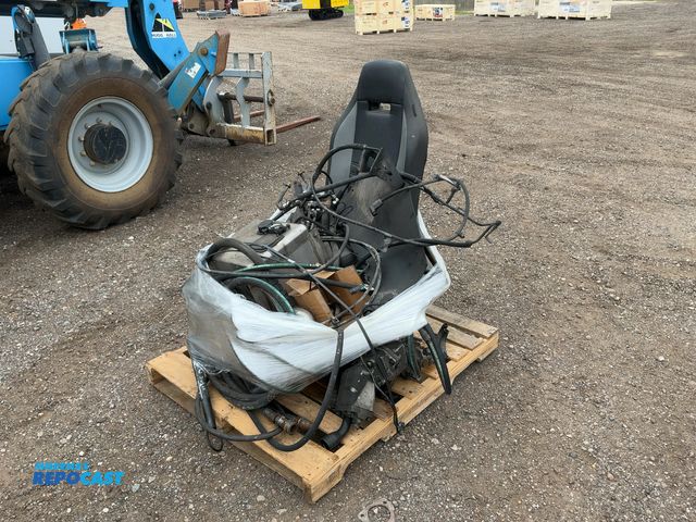 Lot 2-11987 - Skid of assorted parts off a Mack Semi Truck, includes seat, fuel filter housing, hydraulic PTO pump...