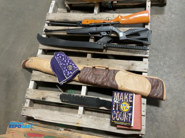 Lot 2-96785 - Skid lot of miscellaneous items including BB guns, gun sleeve, machetes, books, and more