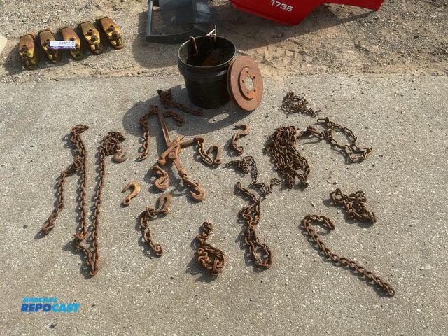 Lot 2-30957 - Lot of assorted used pieces of chain, some hooks, one chain binder, and a brake rotor