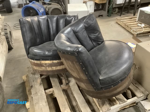 Lot 2-67020 - 2 Black leather whiskey barrel cushioned chairs