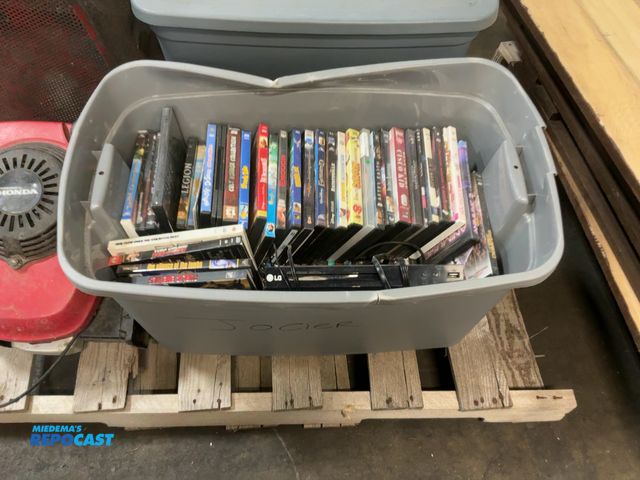 Lot 2-32898 - Tub of assorted DVDs and (1) DVD/CD player