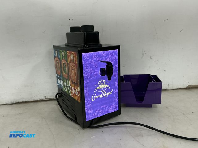 Lot 2-96763 - Crown royal shot dispenser with bottle plugs in ports and napkin/straw holder