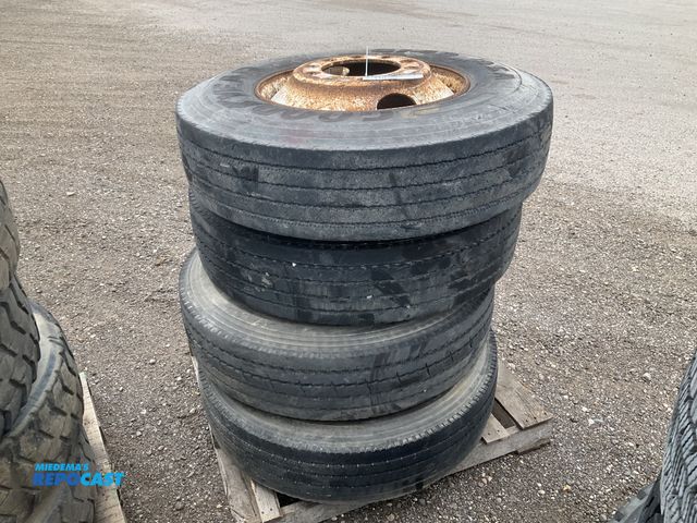 Lot 2-11830 - (4) 11R22.5 semi tires on steel wheels, used