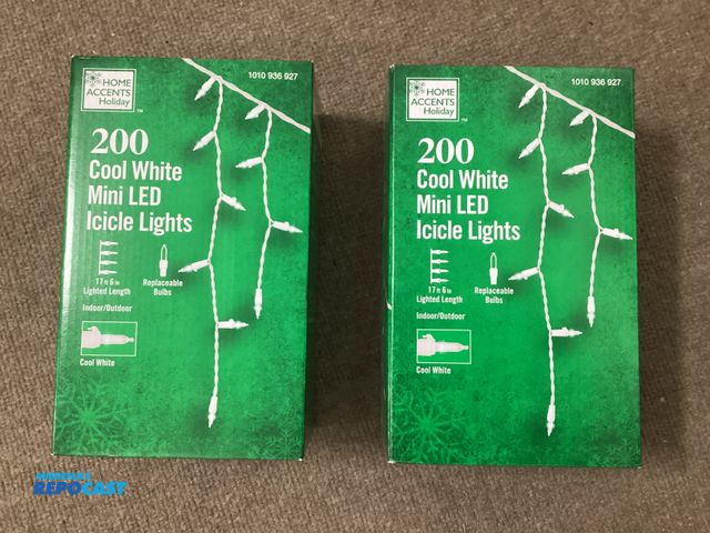 Lot 2-67342 - Two new boxes of Home Accents 200 bulb Cool White Mini LED Icicle Lights. 17’ 6” lighted length. Con...