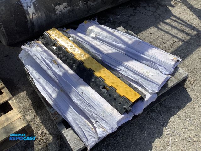 Lot 2-94936 - Skid lot of (6) black and yellow hazard mats for safety walking with plastic piece to come up so no ...
