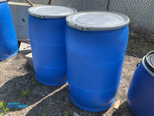 Lot 2-99359 - (2) 55 gallon blue plastic barrels w/ removable &amp; locking ring - contained a food product