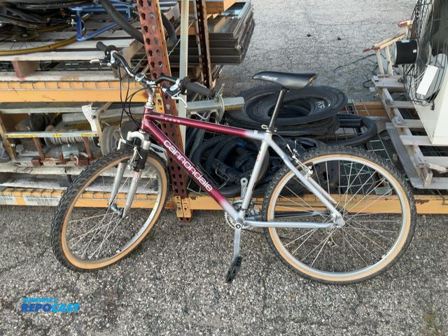 Lot 2-33010 - Canondale F400 profile design rock shox red and silver Mountain Bike with a attached water bottle ho...