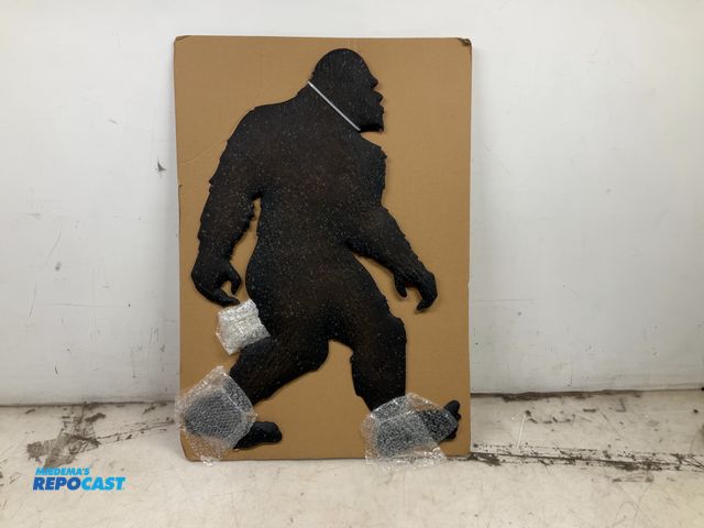 Lot 2-19566 - Metal Sasquatch decor sign, 28” x 17”
