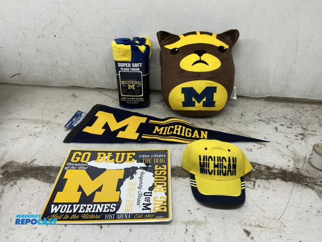 Lot 2-65690 - lot of Michigan Wolverine Merchandise includes: Metal Michigan Sign 12 x 12, 15" Mich. mascot Pillow...