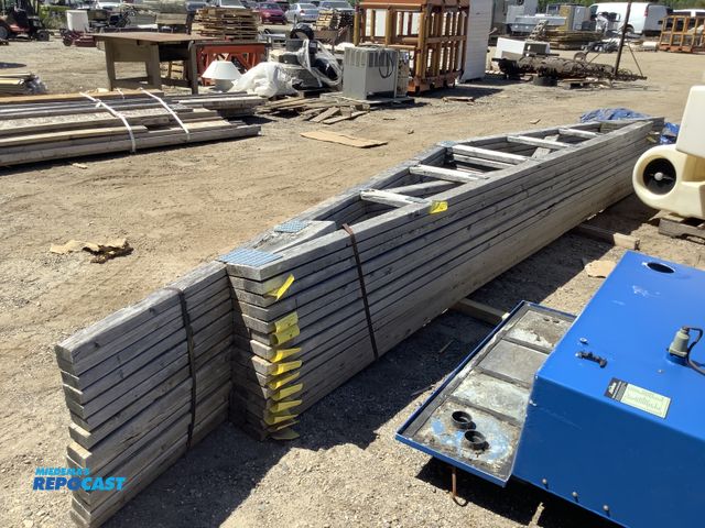 Lot 2-75263 - Lot of (14) large wooden building trusts just under 20’ long
