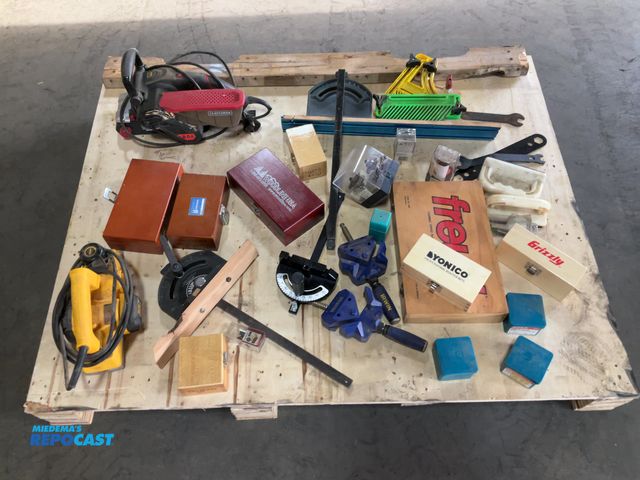 Lot 2-15544 - Skid lot of woodworking tools including: sanders, router bits, and more