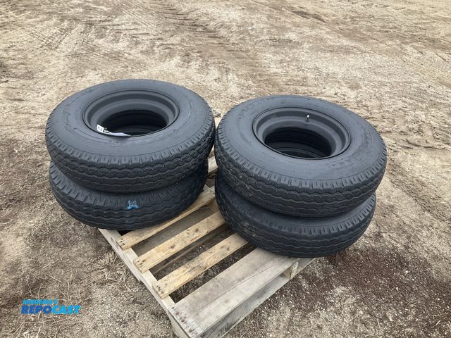 Lot 2-11559 - (4) 8-14.5 tires on steel mobile home style wheels, used