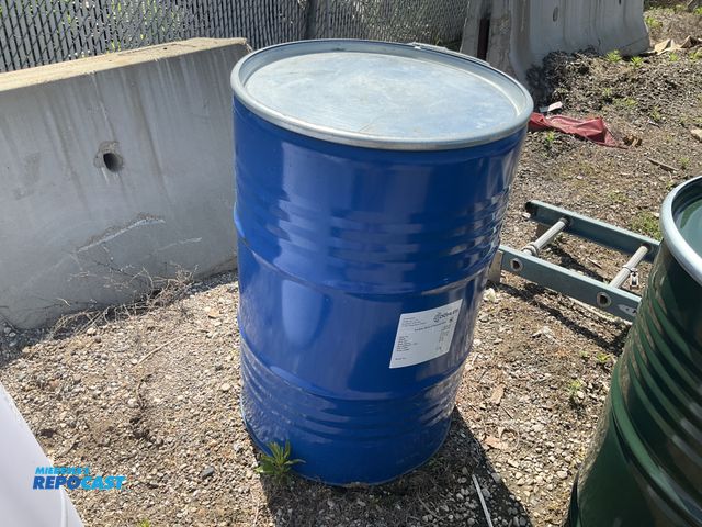 Lot 2-99356 - 55 gallon blue steel barrel w/ removable lid &amp; locking ring - contained grape juice