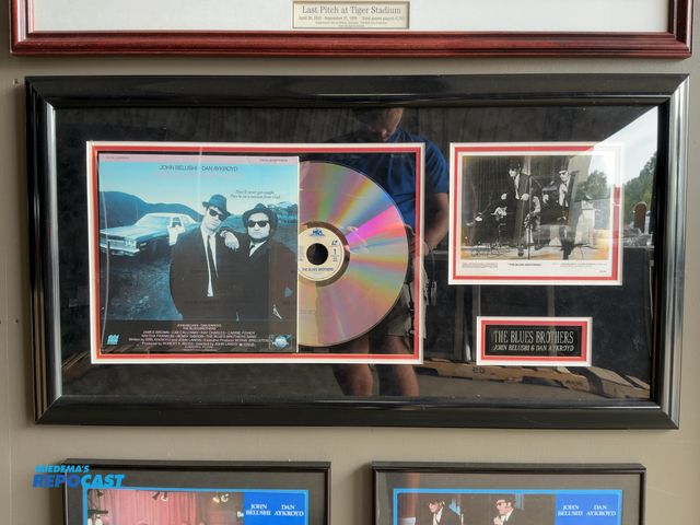 Lot 2-53327 - Framed “The Blues Brothers” Record, Picture, and Plaque, 41.5” x 22.25”