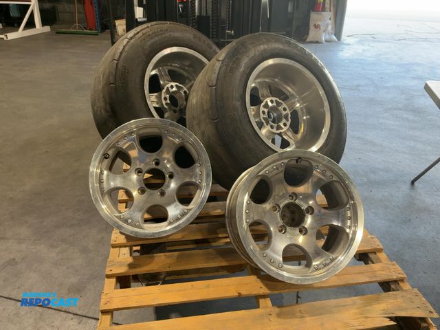 Lot 2-15319 - Pair of Mickey Thompson P275/60R15 Tires on Rims with an extra set of Aluminum Rims