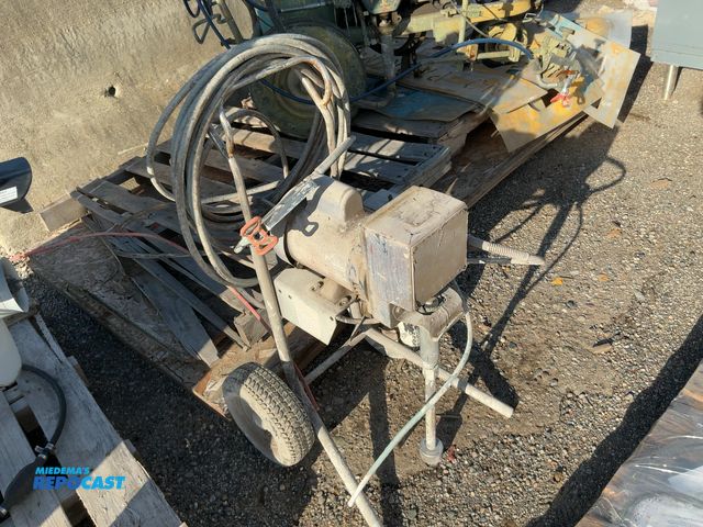 Lot 2-33062 - Paint sprayer with hose and nozzle, 2 wheels, make and model are covered up