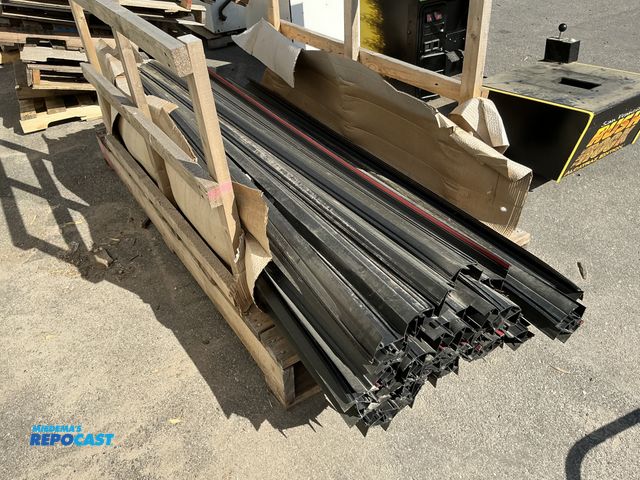 Lot 2-76752 - Crate of black rubber door seals approximately 97” long