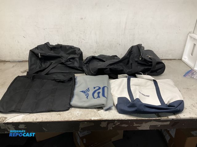 Lot 2-95988 - Dry Goods grey blanket, a Marianna duffle bag style suitcase, a Bristol West bag, and (2) black bags