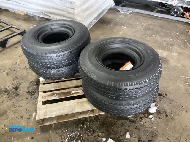 Lot 2-42049 - (4) 8-14.5 tires on steel mobile home style wheels, used