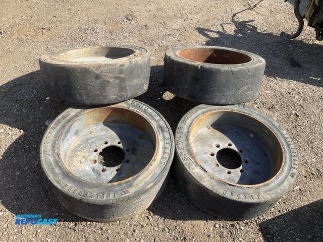 Lot 2-44723 - (4) 31x5x9 solid rubber skid steer tires, used