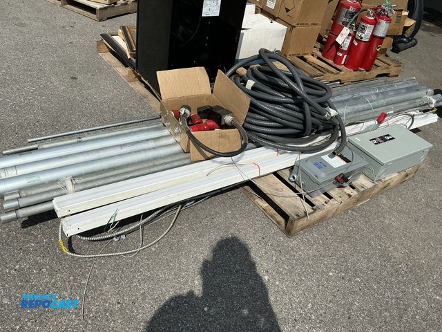 Lot 2-13276 - Skid lot of electrical equipment some plastic tubing 2 metal electrical boxes some LED lights and a ...